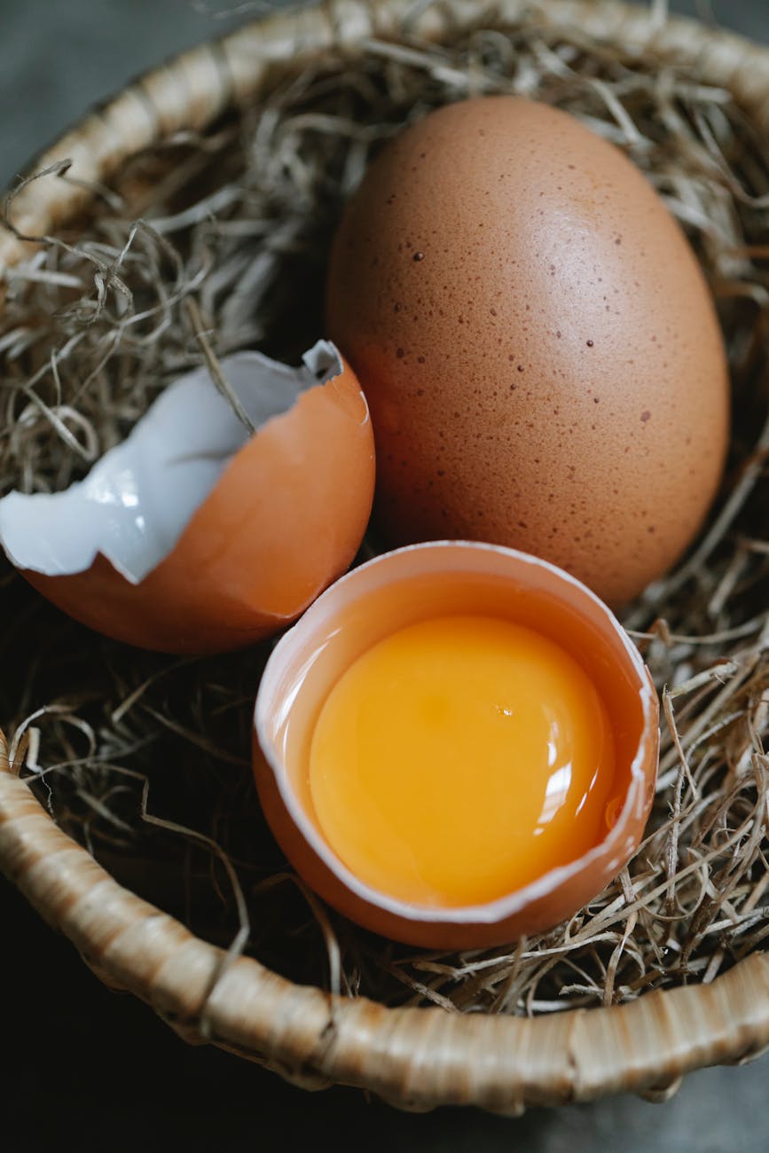 raw brown chicken eggs placed in small wicker basket